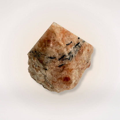 Polished Sunstone crystal tower with natural sides, showcasing vibrant orange hues and dark mineral streaks for uplifting energy.