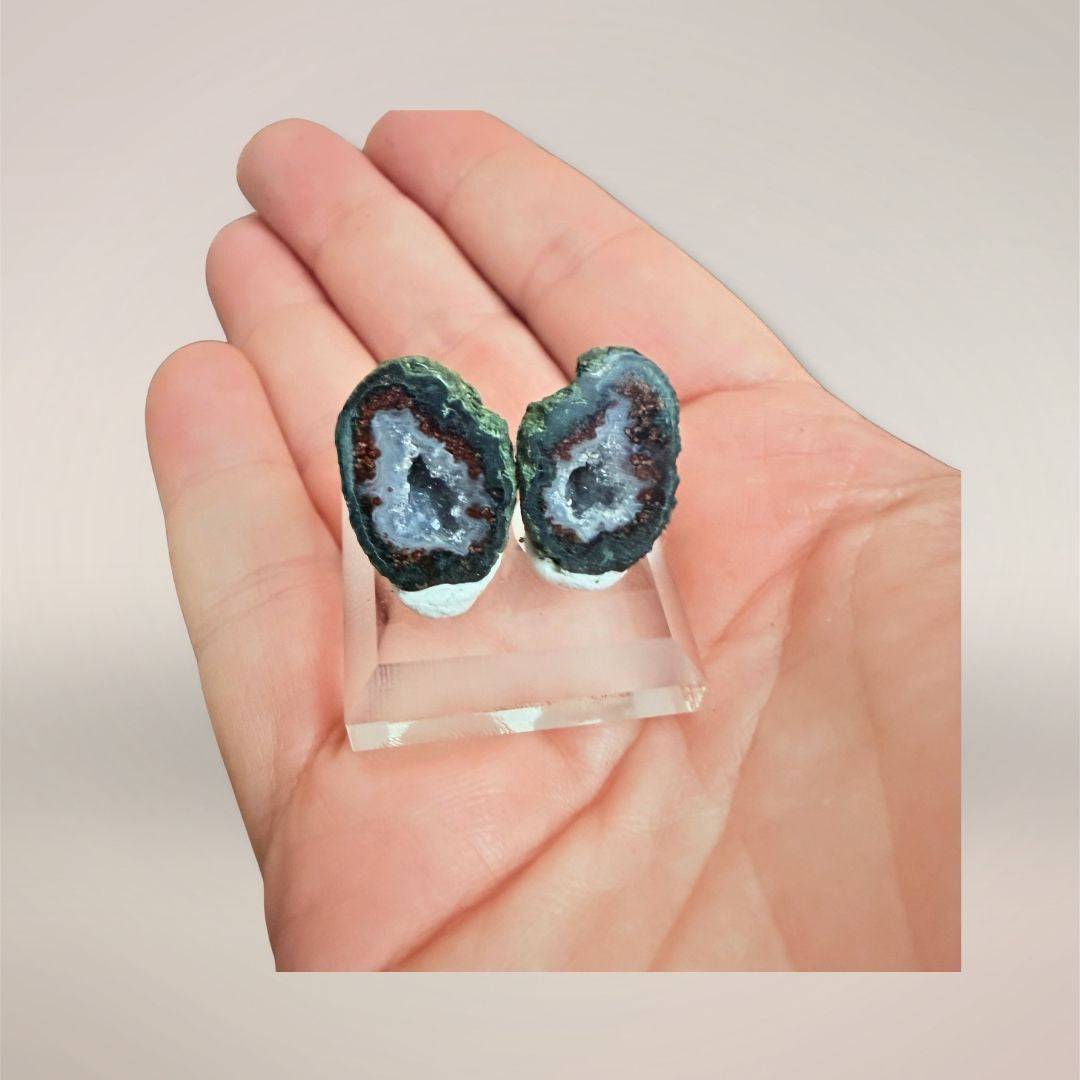 Miniature Tabasco agate micro-geode pair on display stand