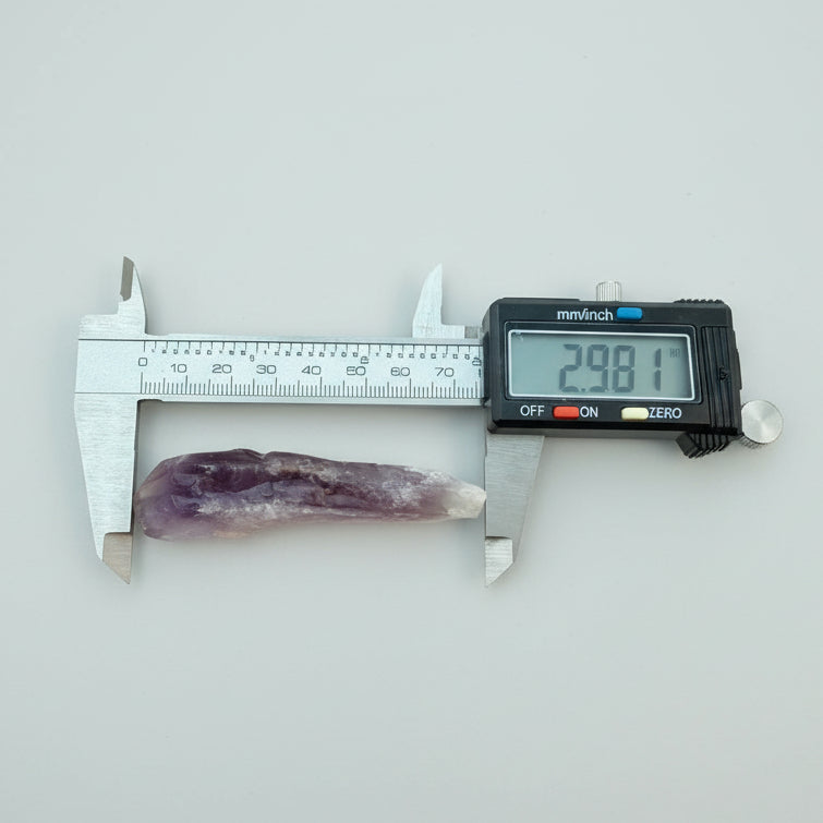 Phantom Amethyst Root Crystal from Brazil measured at 2.98in with digital caliper, showcasing natural termination and deep purple hues.