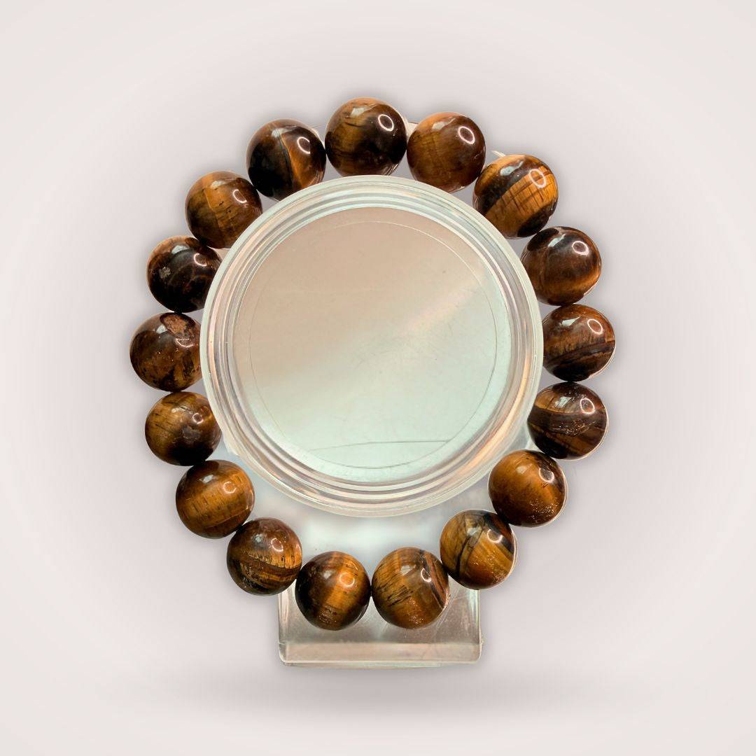 Tiger's Eye 12mm Beaded Bracelet for Protection & Confidence displayed in a circular arrangement, showcasing polished brown-golden beads.