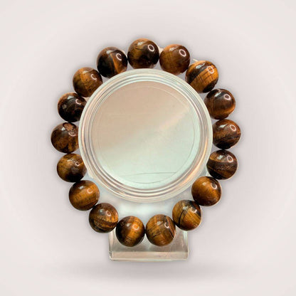 Tiger's Eye 12mm Beaded Bracelet for Protection & Confidence displayed in a circular arrangement, showcasing polished brown-golden beads.