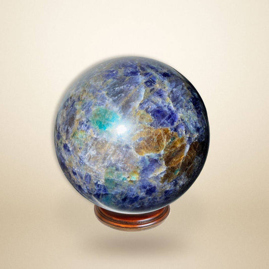 Trinity Stone Sphere 348g • Heart–Mind Alignment Crystal with deep blue, green, and golden hues on a wooden stand, ideal for energy balancing.