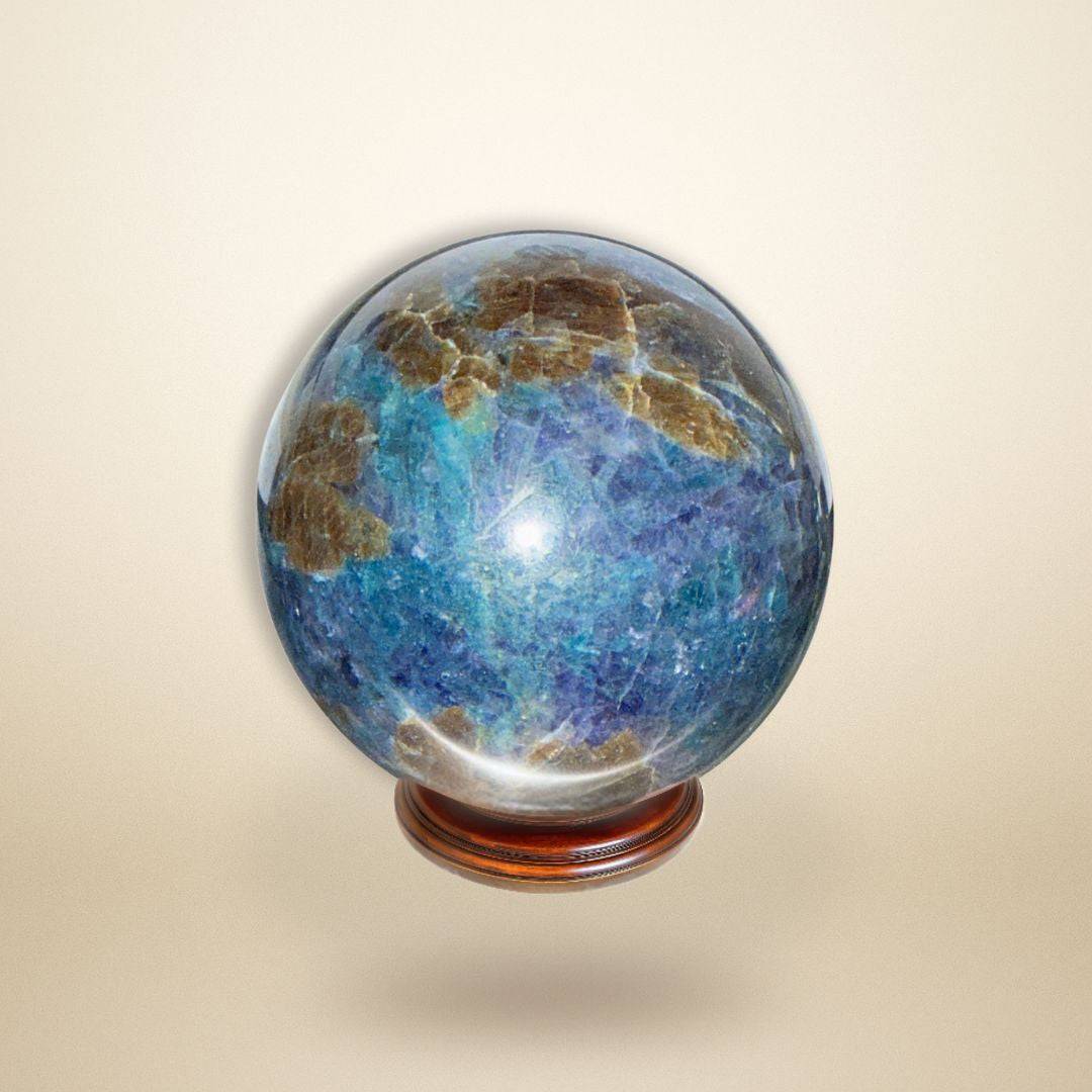 Trinity Stone Sphere 458g featuring Fuchsite, Kyanite, and Garnet displayed on wooden base against neutral background for gemstone collectors.