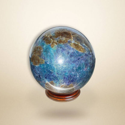 Trinity Stone Sphere 458g featuring Fuchsite, Kyanite, and Garnet displayed on wooden base against neutral background for gemstone collectors.