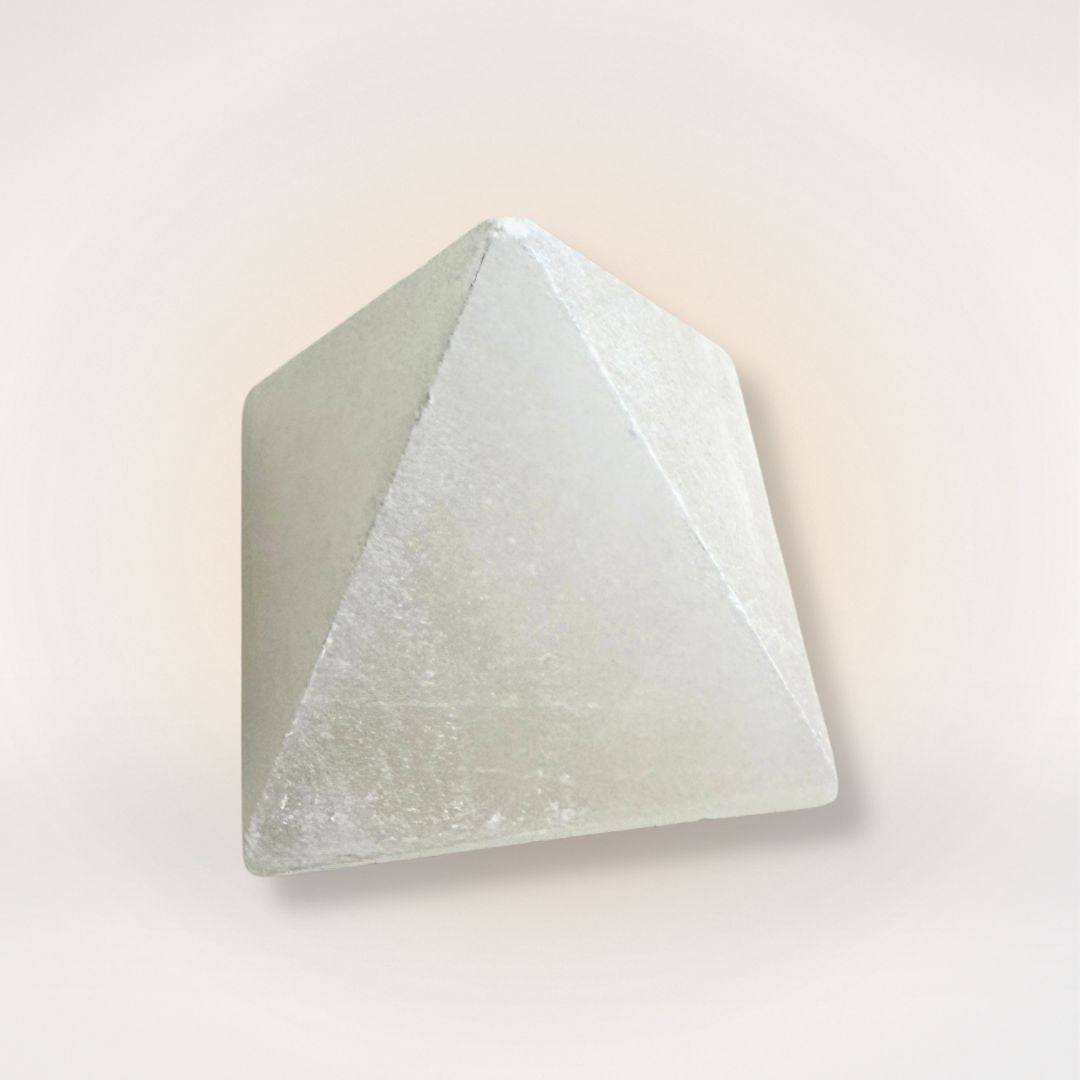 White Selenite Pyramid for Clarity and Energy Amplifying with smooth polished finish, ideal for home décor and spiritual cleansing rituals.