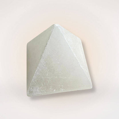 White Selenite Pyramid for Clarity and Energy Amplifying with smooth polished finish, ideal for home décor and spiritual cleansing rituals.
