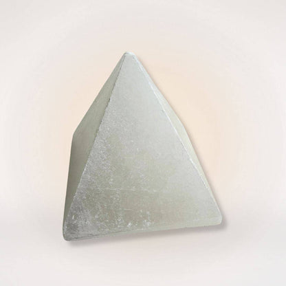 Polished White Selenite Pyramid from Morocco, known for energy amplification and clarity, perfect for serene home and garden figurine displays.