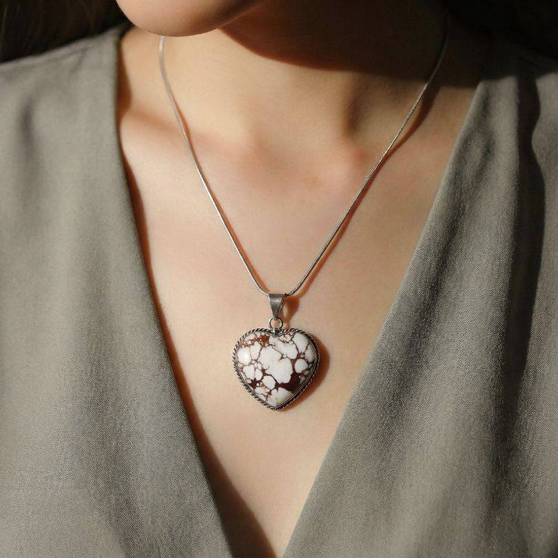 Wild Horse Jasper Heart Pendant worn on model, highlighting its grounding energy and emotional balance in a stylish jewelry setting.