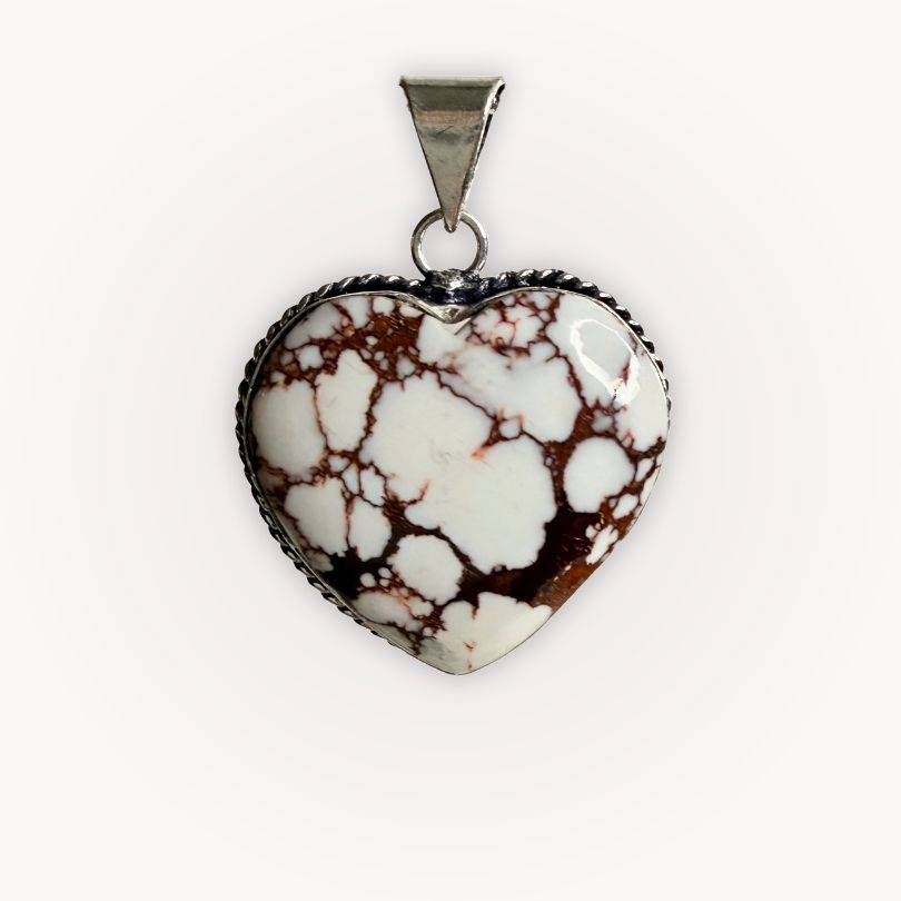Close-up of Wild Horse Jasper Heart Pendant with bold brown and white patterns, symbolizing calm strength and grounding energy.
