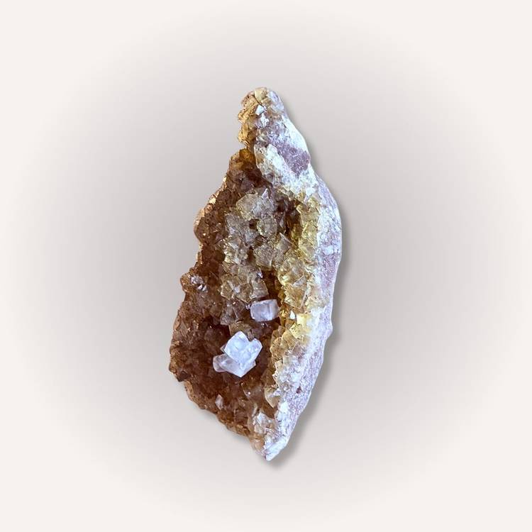 Side view of yellow & clear fluorite specimen featuring cubic crystal formations and vibrant clarity, perfect for mineral collectors.