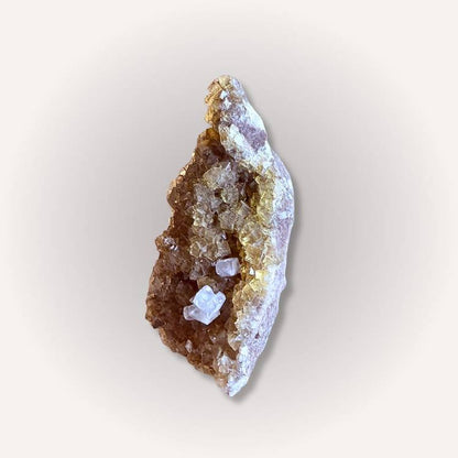 Side view of yellow & clear fluorite specimen featuring cubic crystal formations and vibrant clarity, perfect for mineral collectors.