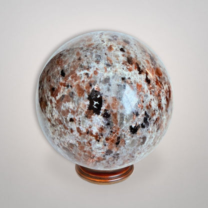Polished UV Sodalite 'Yooperlite' Sphere 464g featuring intricate mineral inclusions, perfect for collectors and crystal enthusiasts.