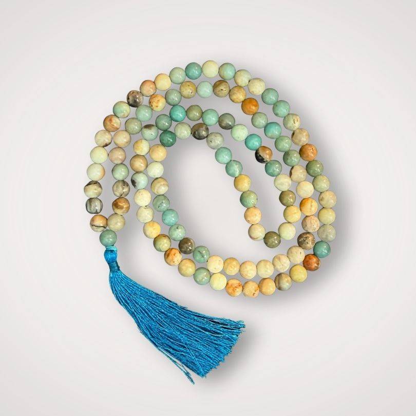 Amazonite Mala Necklace for Calm with 108 polished beads and a blue tassel, ideal for meditation and emotional balance practices.