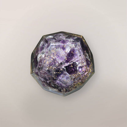 Back view of handmade Amethyst orgonite dodecahedron showing purple crystal chips, copper flakes, and faceted resin texture