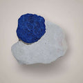 Single Azurite Sun specimen from Malbunka Copper Mine, Australia, with one vivid blue radial disc on pale kaolinite matrix.