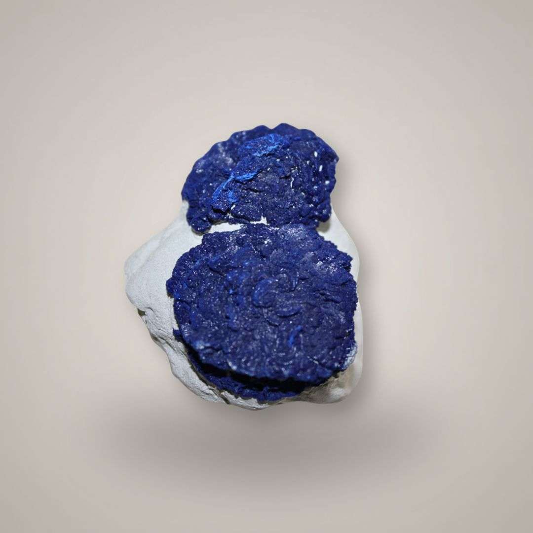 Rare Azurite Sun pair from Malbunka Copper Mine, Australia, showing two gemmy deep blue radial azurite suns.