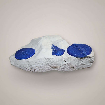 Side view of Azurite Sun specimen showing flattened radial azurite discs along kaolinite matrix.