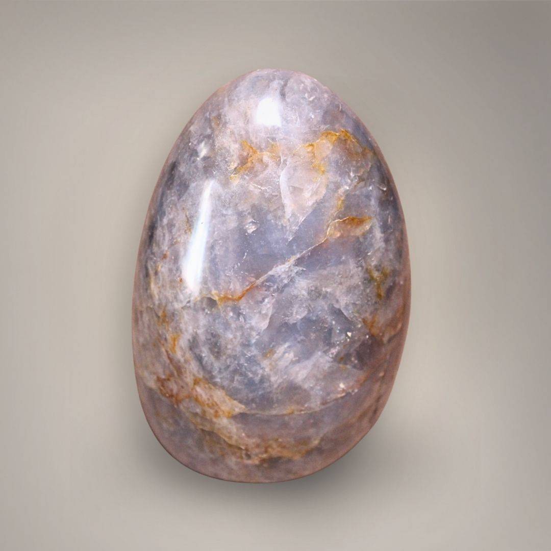 Reverse view of polished Blue Rose Quartz with lavender-blue coloration and branching ochre veining.