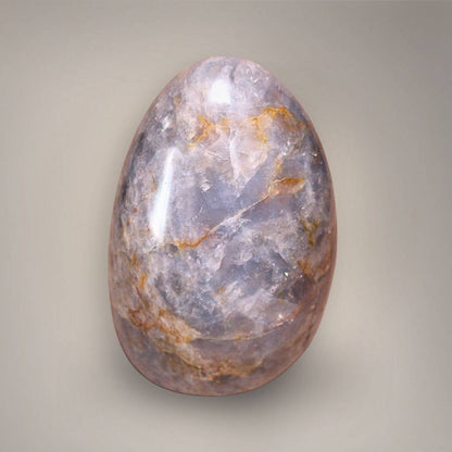 Reverse view of polished Blue Rose Quartz with lavender-blue coloration and branching ochre veining.