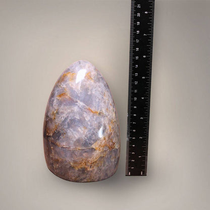 Six-inch-tall Blue Rose Quartz standing freeform from Madagascar photographed beside a measuring ruler.
