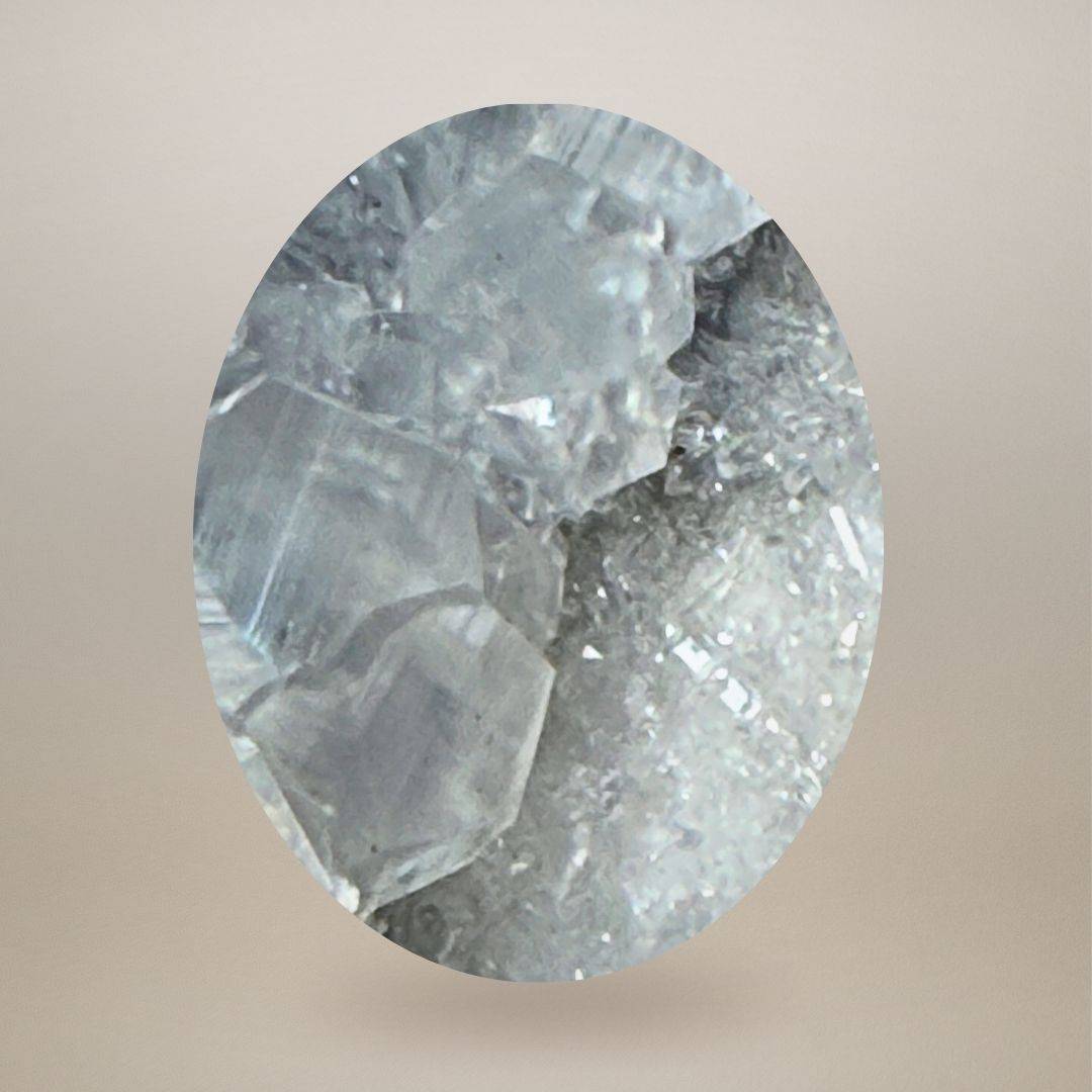 Macro view of Maharashtra apophyllite and intergrown calcite showing the transition between larger clear crystal faces and fine secondary crystal growth.