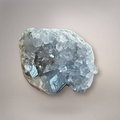 Sky blue Celestine geode cluster with sparkling crystals, Madagascar origin, natural mineral specimen for calming and clarity. 830g