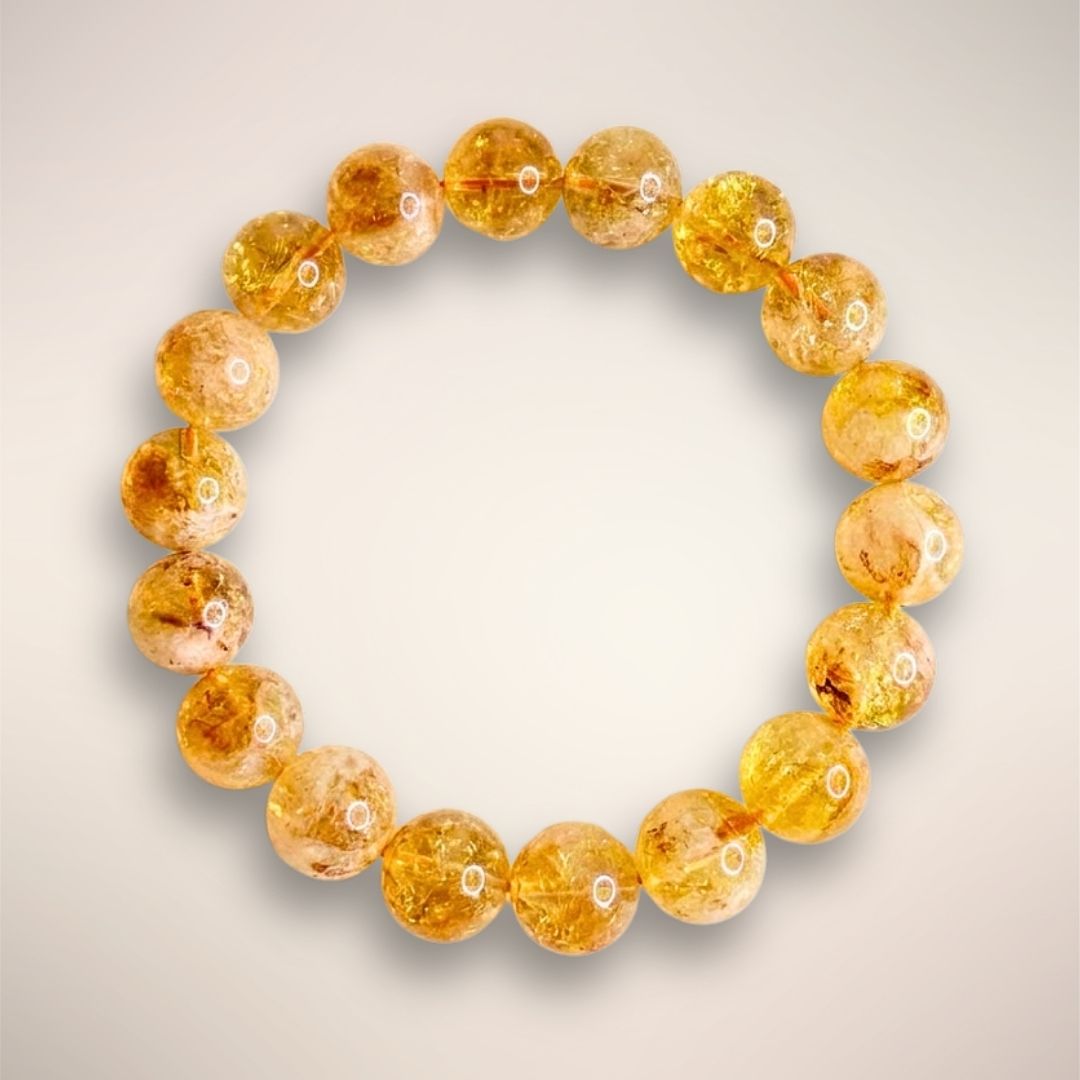 12mm Brazilian Citrine beads showcasing natural inclusions and golden clarity