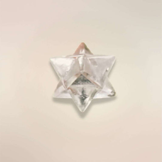Single Clear Quartz Merkaba stone from Brazil showing the carved sacred geometry shape.