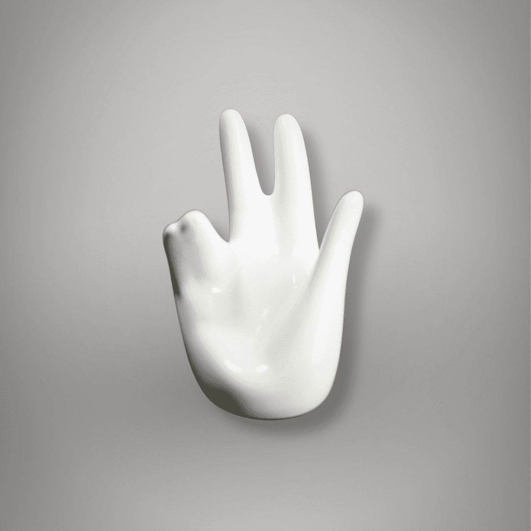 Front view of white ceramic hand-shaped sphere and egg holder showing its open-palm design and smooth glossy finish.