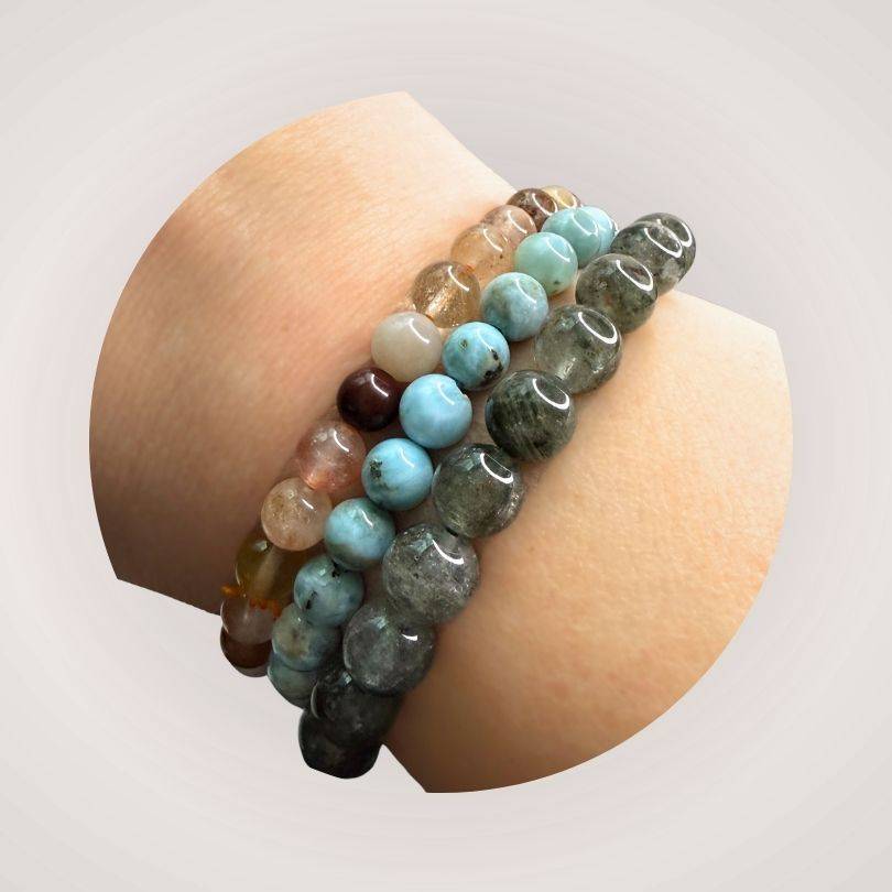 Stacked beaded bracelets on wrist featuring Lodolite (Garden Quartz) 8mm bracelet, ideal for jewelry lovers seeking inner clarity and grounding.