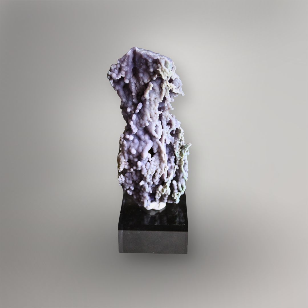 Back of 183g Indonesian Grape Agate cluster showing layered purple quartz growth, recessed cavities, and pale mineral coatings