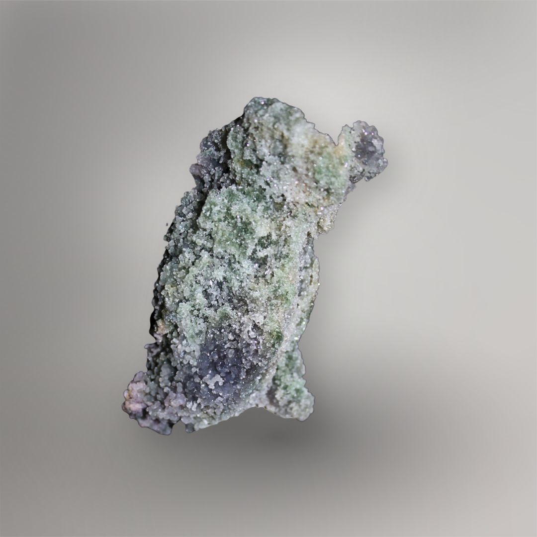 Reverse of 259g Indonesian Grape Agate cluster showing green clay-rich matrix beneath a fine sparkling quartz coating