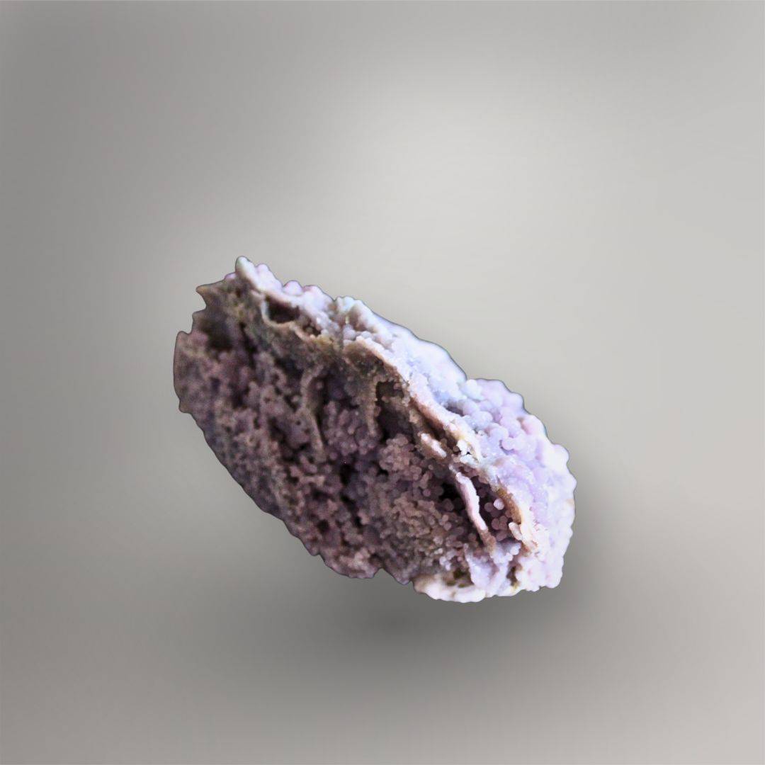 Side view of 335g Grape Agate cluster showing overlapping mineral layers, open pockets, and pale lavender quartz growth