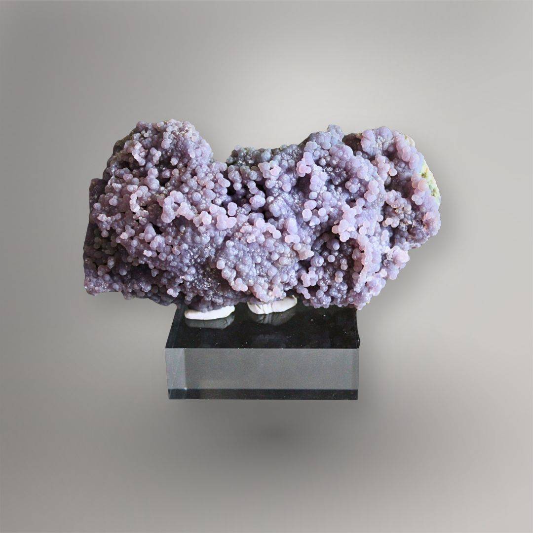 Front view of wide 374g Grape Agate cluster with dense pink-lavender quartz spheres and sculptural ridges
