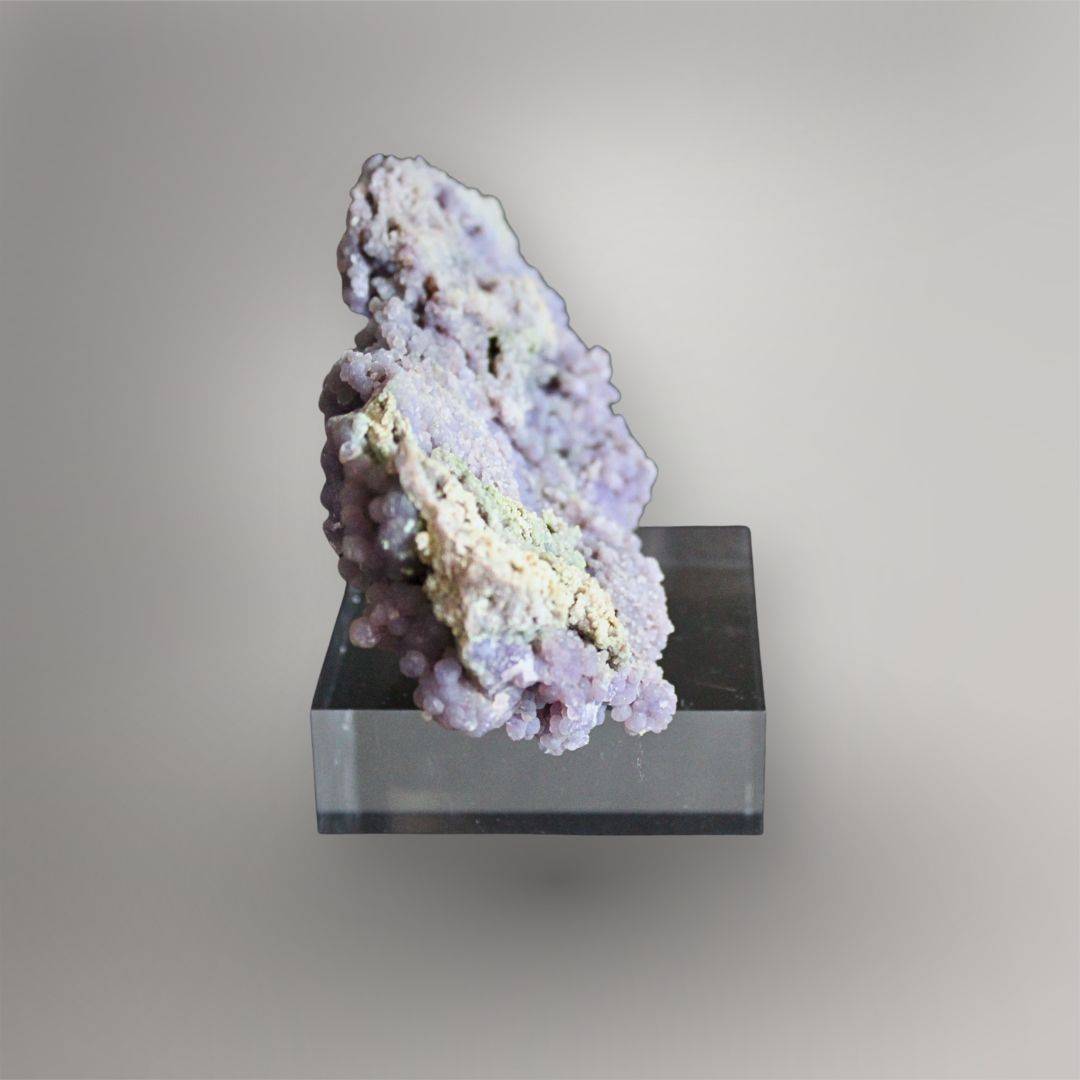 Narrow side view of 374g Grape Agate cluster showing layered pocket walls and cream to green mineral texture