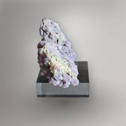 Narrow side view of 374g Grape Agate cluster showing layered pocket walls and cream to green mineral texture