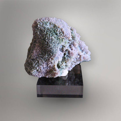 Reverse of 437g Indonesian Grape Agate cluster showing lavender quartz, green mineral areas, broad cavities, and layered texture