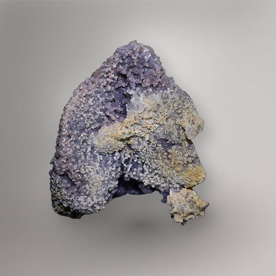 Back of 770g Indonesian Grape Agate cluster showing pale tan natural matrix and purple spheroidal quartz growth