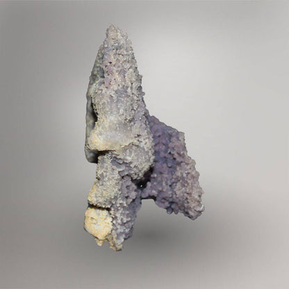 Side view of 770g Grape Agate cluster showing layered lilac quartz spheres and pale natural matrix