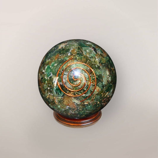 Green Aventurine orgonite sphere with Brazilian Green Aventurine chips, copper spiral, copper flakes, and wood display stand