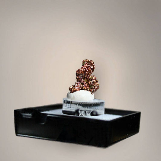 Reverse view of native copper thumbnail from China showing compact, irregular crystalline growth with reflective copper-red, bronze, and golden metallic surfaces on a small acrylic riser.