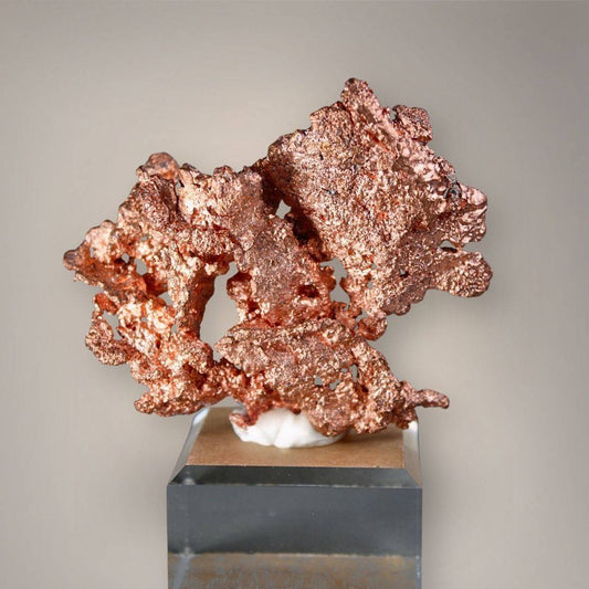 Front view of native copper from China showing copper-red metallic branches, openwork formations, and irregular crystalline texture on a clear acrylic base.