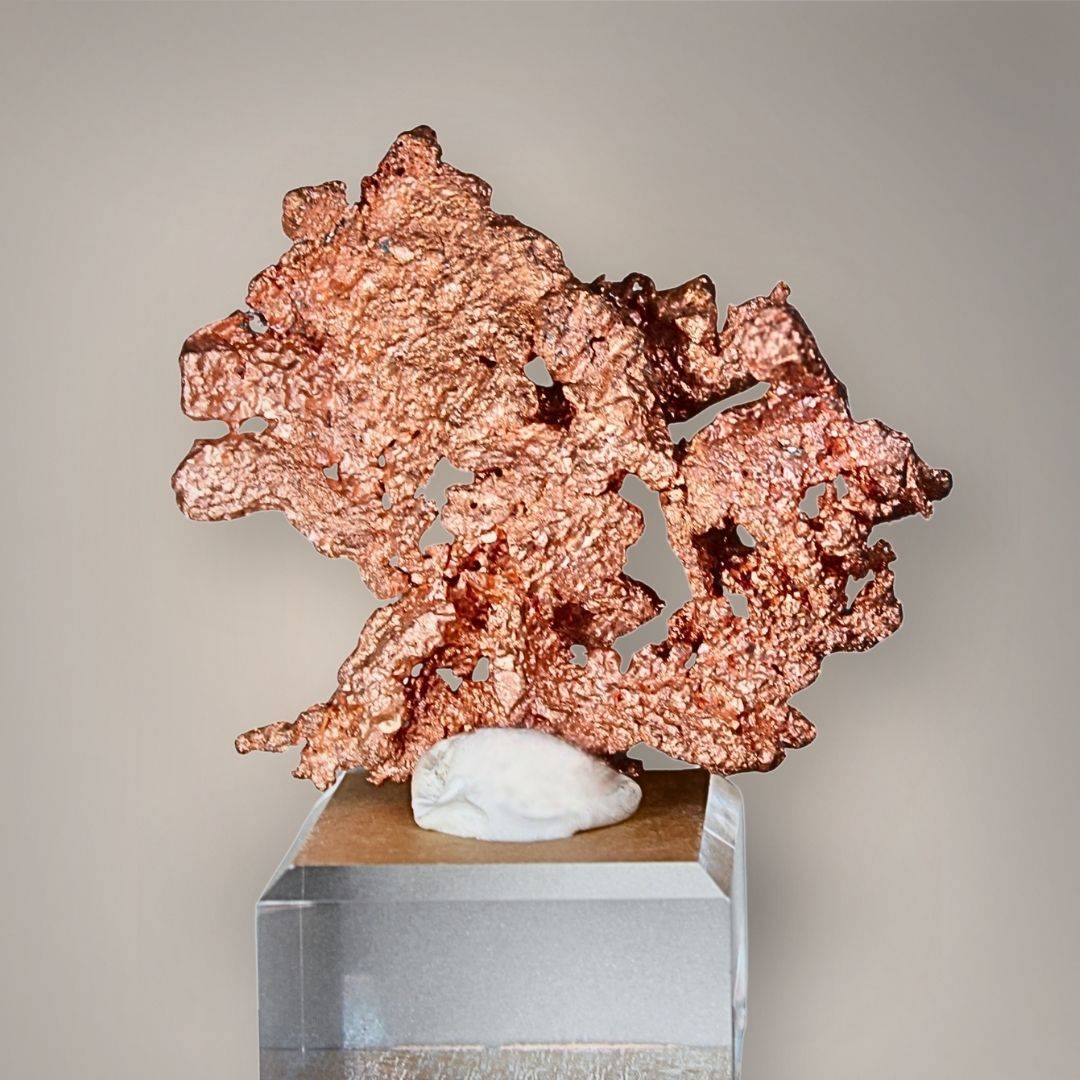 Reverse view of Chinese native copper specimen displaying broad branching metallic formations, copper-red color, and naturally irregular openings.