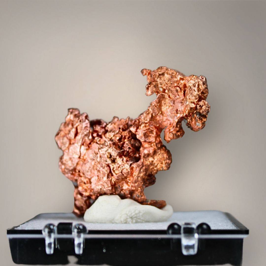 Reverse view of Chinese native copper showing a compact cluster of interconnected metallic growths, irregular crystalline projections, and bright copper-red surfaces.