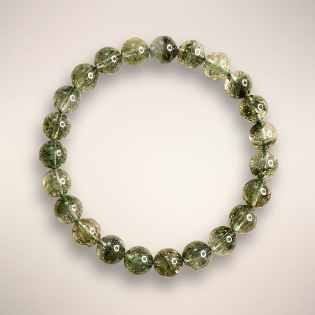 Lodolite (Garden Quartz) 8mm beaded bracelet displayed on a clear stand