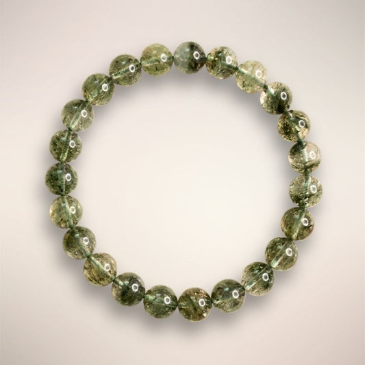 Lodolite (Garden Quartz) 8mm beaded bracelet displayed on a clear stand