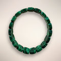 Malachite flat bead bracelet 14×9mm on a double elastic stand
