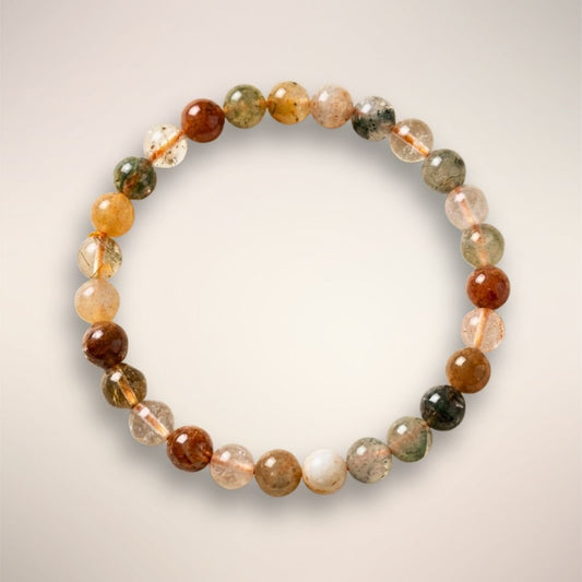 Mixed Rutile Quartz 6mm beaded bracelet displayed on a elastic stand, showcasing multicolored translucent beads for clarity and intuitive flow.