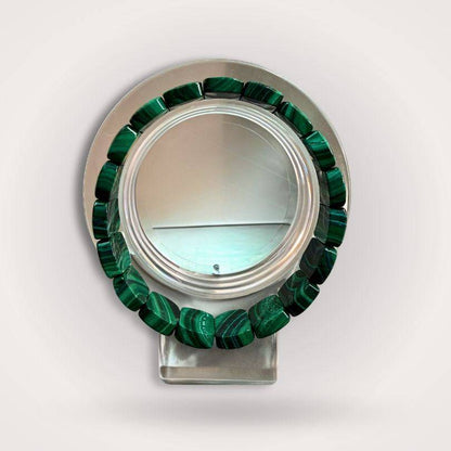 Malachite flat bead bracelet 14×9mm displayed on a clear stand, showcasing vivid green banding and polished finish for transformation and protection.
