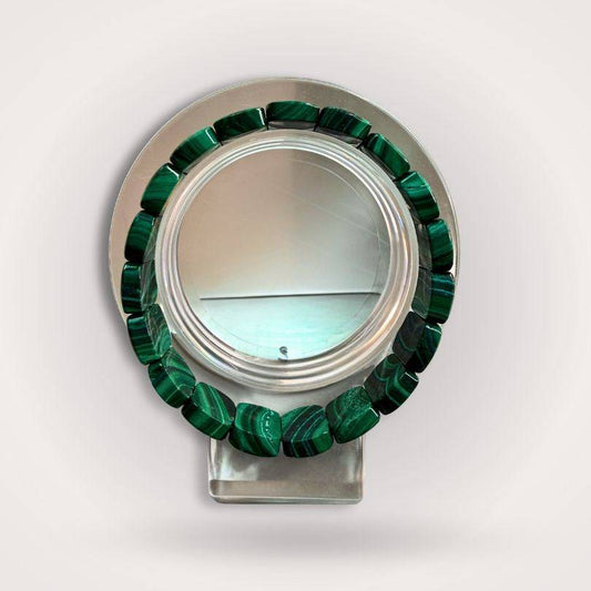 Malachite flat bead bracelet 14×9mm displayed on a clear stand, showcasing vivid green banding and polished finish for transformation and protection.